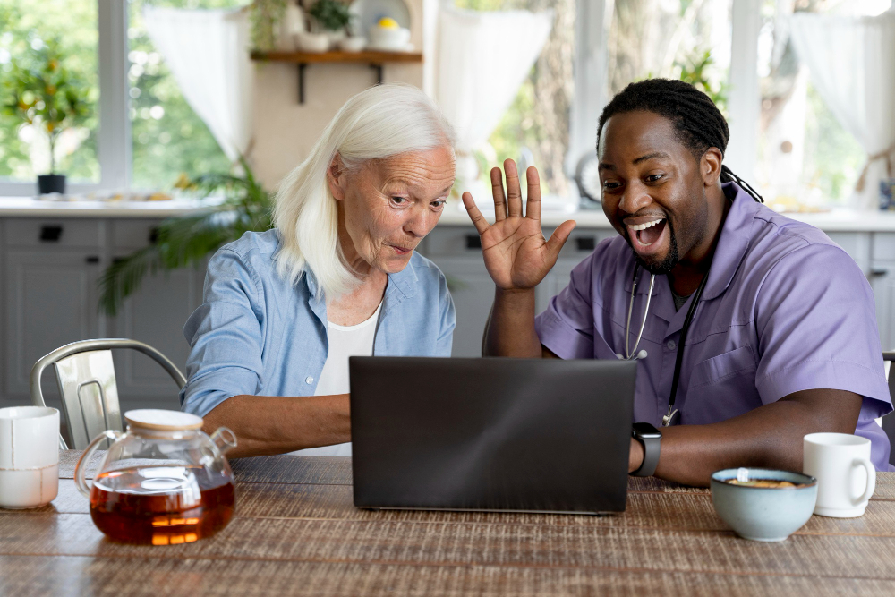 Learning Disabilities Care in South Wales-African social worker taking care of a senior woman