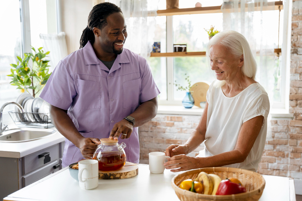 Supported Living In Porthcawl, African social worker helping a senior woman